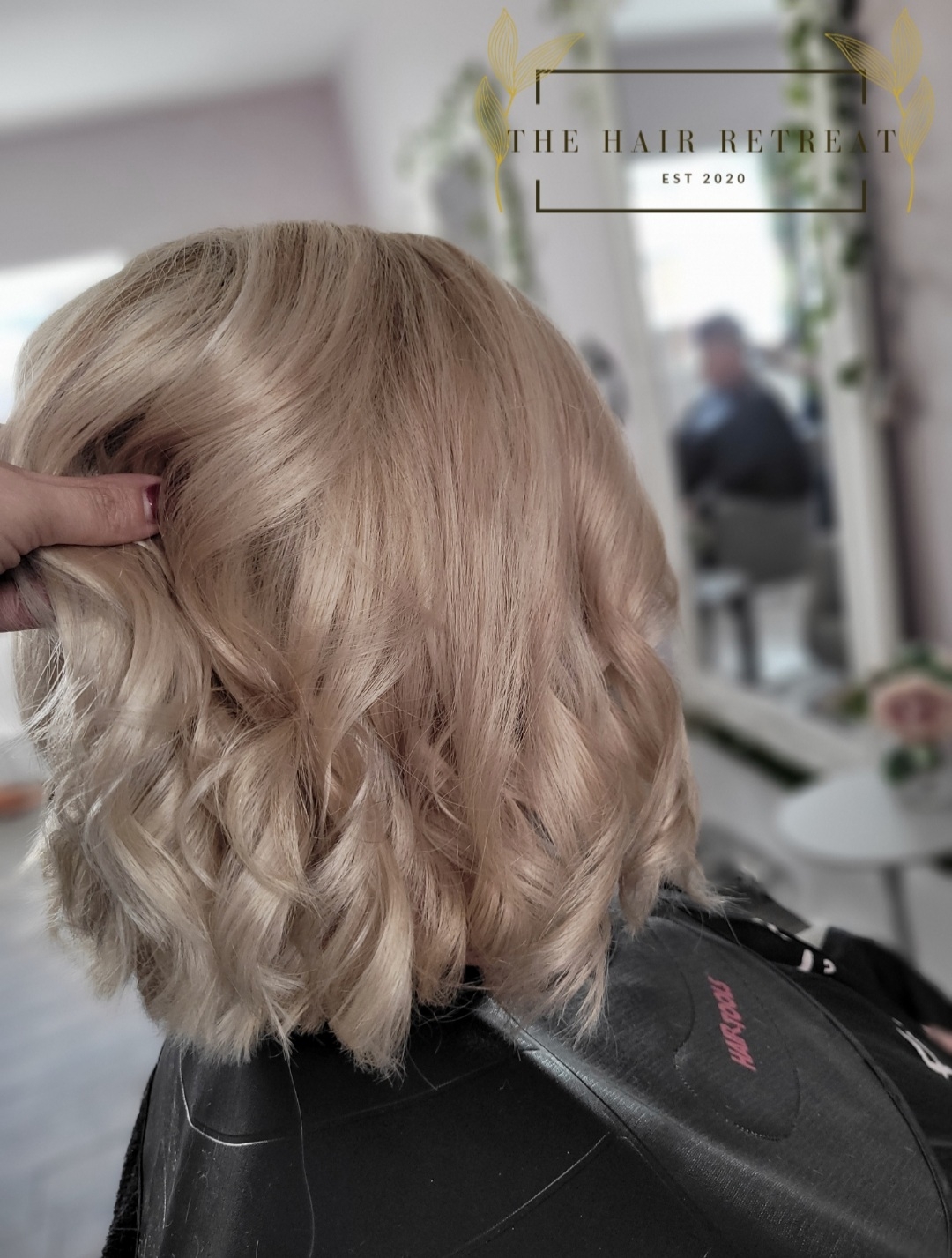 A curled blonde bob